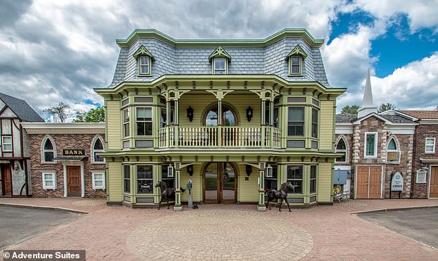 Pictured is the exterior of Adventure Suites. The hotel offers a variety of extravagantly themed rooms, including 'The Cave' and 'Jungle' suites.