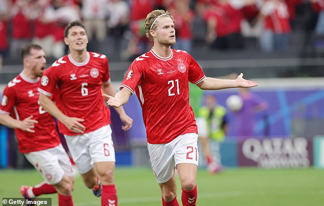 Morten Hjulmand (center) scored a goal for Denmark with a long shot before the break.