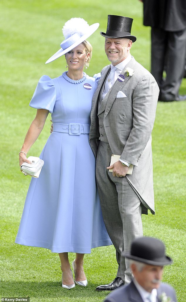 Zara stole the show on Ladies' Day in a dazzling blue dress, accompanied by her rugby player husband, Mike Tindall, who looked dapper in a gray suit and top hat.