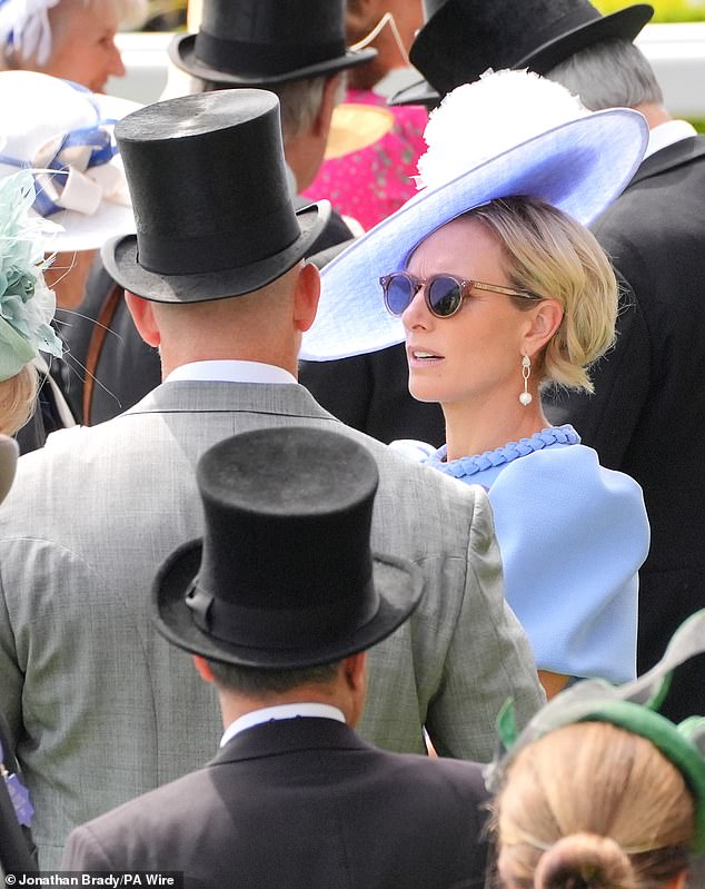 Power couple Zara and Mike were seen chatting while waiting for the races.