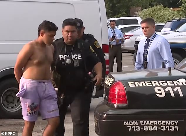 Johan José Rangel Martínez, 22, appears in the photograph during his arrest. Police said the suspects resided in the same apartment complex as the victim.