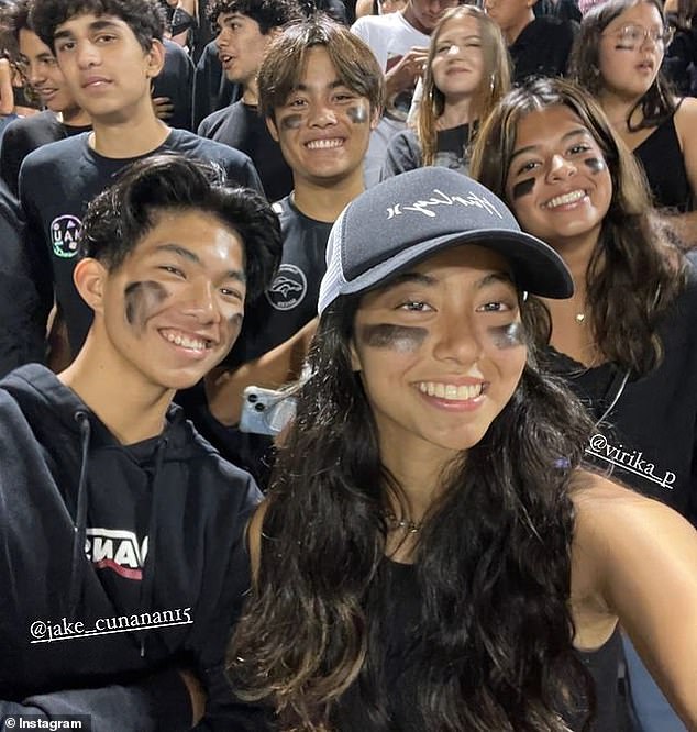 Sarina (right) with Jake (left) and their friends at a sports game.