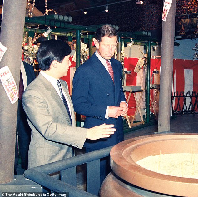 Then-Japanese Crown Prince Naruhito and Prince Charles view an exhibition after the opening ceremony of the 1991 Japan Festival at the Victoria & Albert Museum.