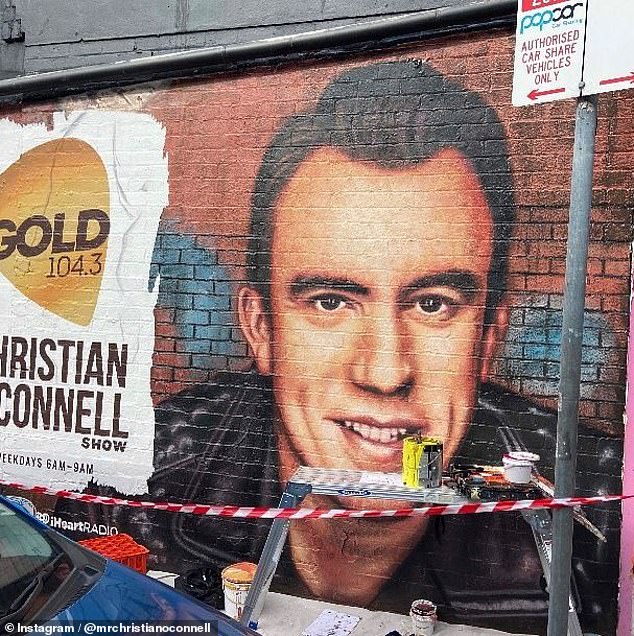 Christian O'Connell's image and his radio station logo appear on a wall in Melbourne.