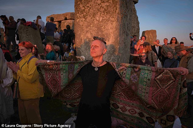 Revelers gather at Stonehenge, Wiltshire, the night before the summer solstice.