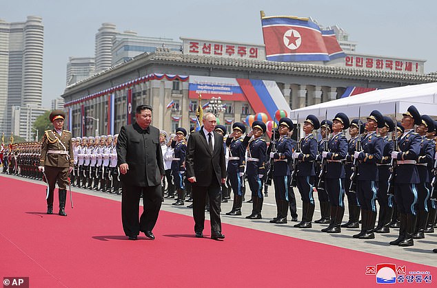 Putin and Kim Jong Un review an honor guard during the official welcoming ceremony at Kim Il Sung Square in Pyongyang, North Korea, on June 19.