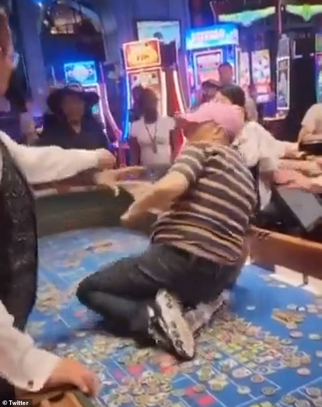 At one point, a casino employee tried to grab her and she slapped him away.