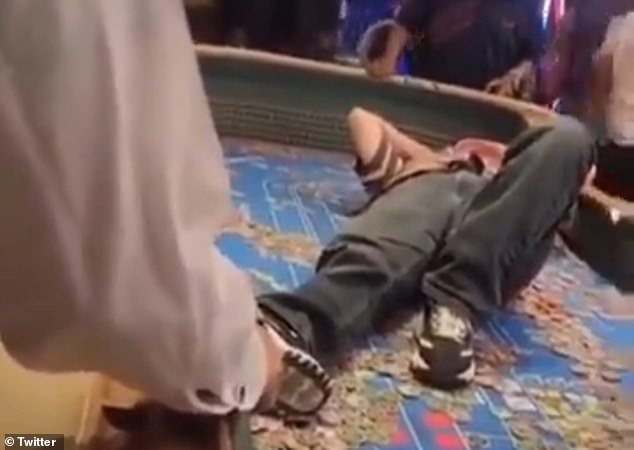 Another video showed Castillo lying on the craps table to avoid being grabbed.