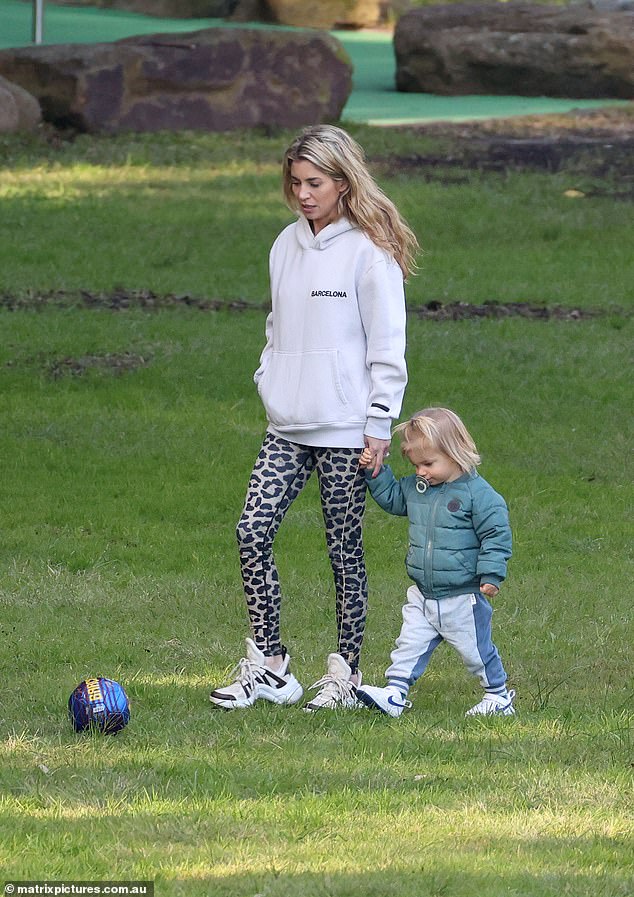 She also wore leopard print leggings that showed off her figure and white sneakers. The mother-of-one wore her blonde hair down and opted for a natural makeup look.