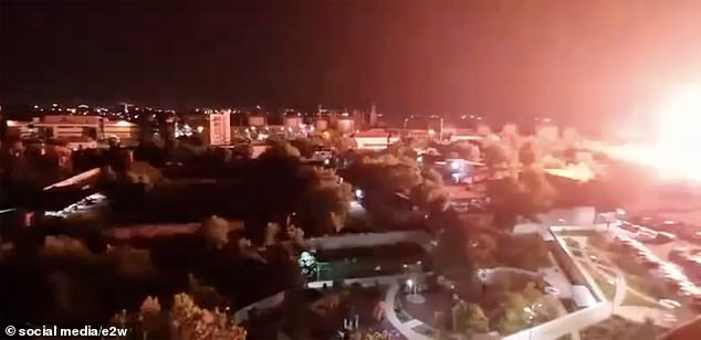 A fireball is seen lighting up the night sky in Russia after a Ukrainian drone attack.