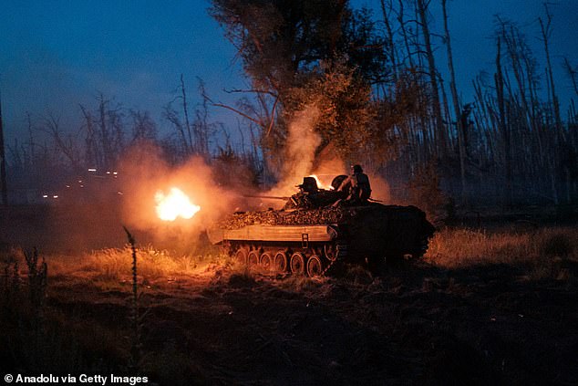 The 1st National Guard Brigade 'Bureviy' fires a tank while carrying out a mission in a BMP-2 to fire on Russian positions in the Serebryanskyy Forest in Luhansk, Ukraine, June 19, 2024.