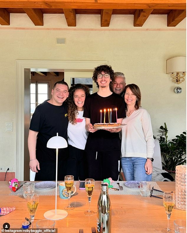 Baggio and his family (pictured) were locked in a room by thieves