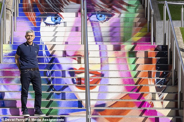 To celebrate Taylor's visit to the iconic stadium, artist Frank Styles (pictured Sadiq Khan) painted a giant mural of the singer's face on the steps.