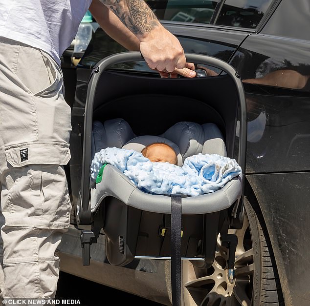 Little Benji was seen wrapped in a blue blanket after his recent stay in hospital.