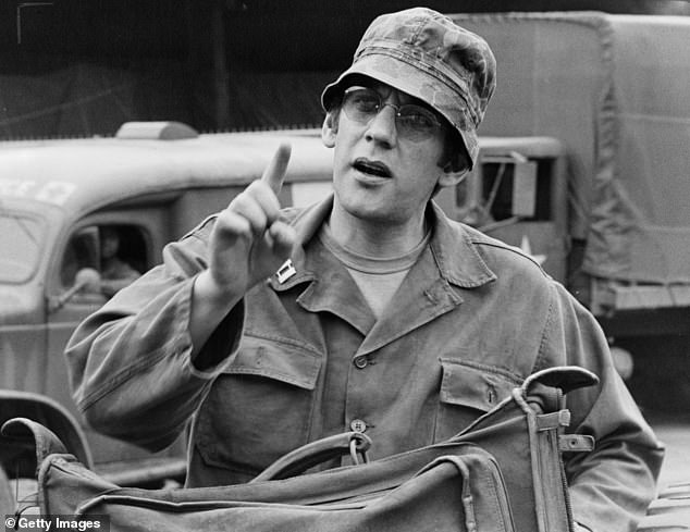 Donald Sutherland making a comment while sitting in a scene from the film 'MASH', 1970