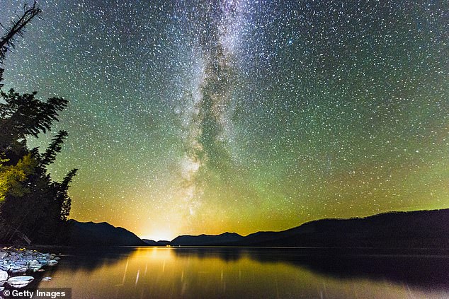 Above, the Northern Lights and Milky Way stars visible over Lake McDonald, the largest lake in Montana's Glacier National Park, far north of this UAP sighting.