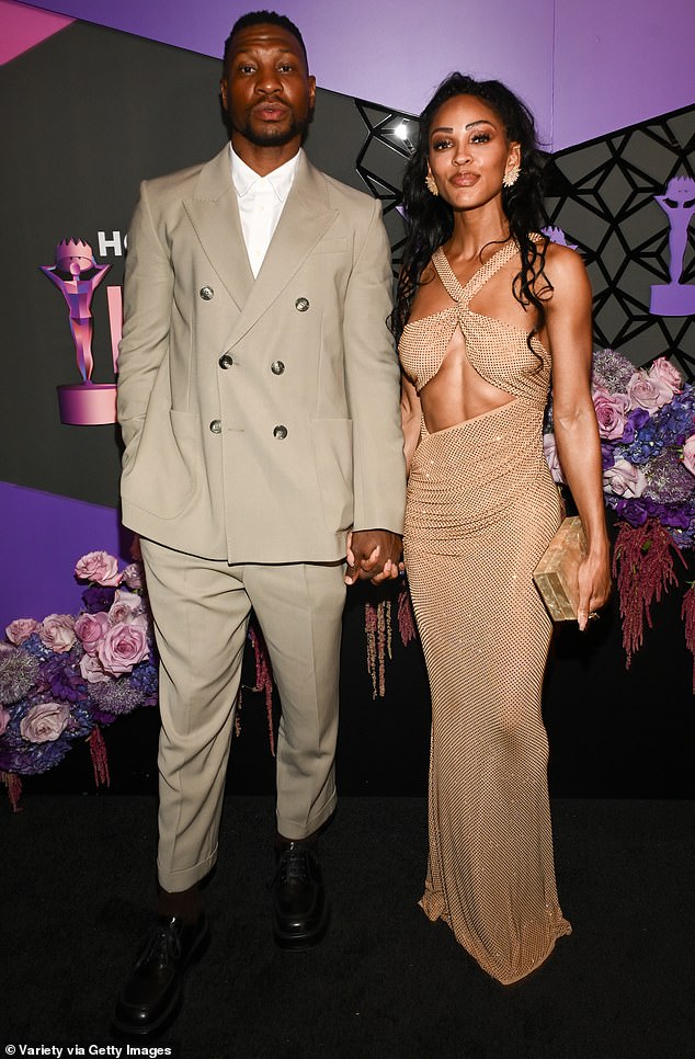 Jonathan Majors wore a beige double-breasted suit while walking the red carpet with Meagan Good.