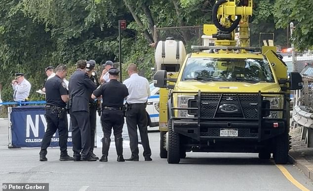 Police are seen at the scene following the beheading of the 86-year-old man.