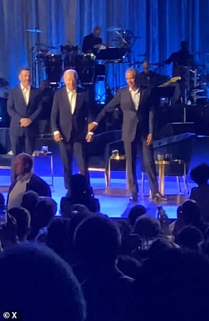 Obama grabs Biden's arm when he freezes at an event