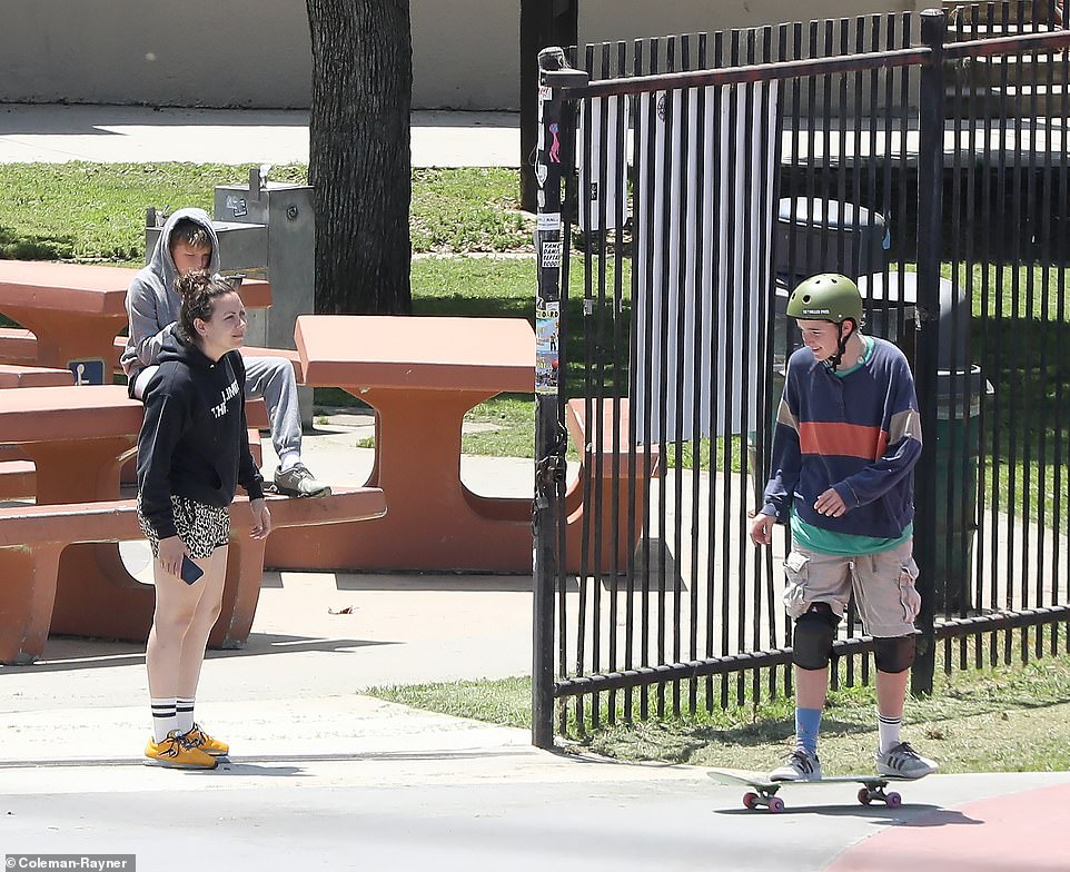 Younger brother Samuel, 12, and an unnamed friend joined Fin in the session, cheering on the 15-year-old from a picnic table outside the park.