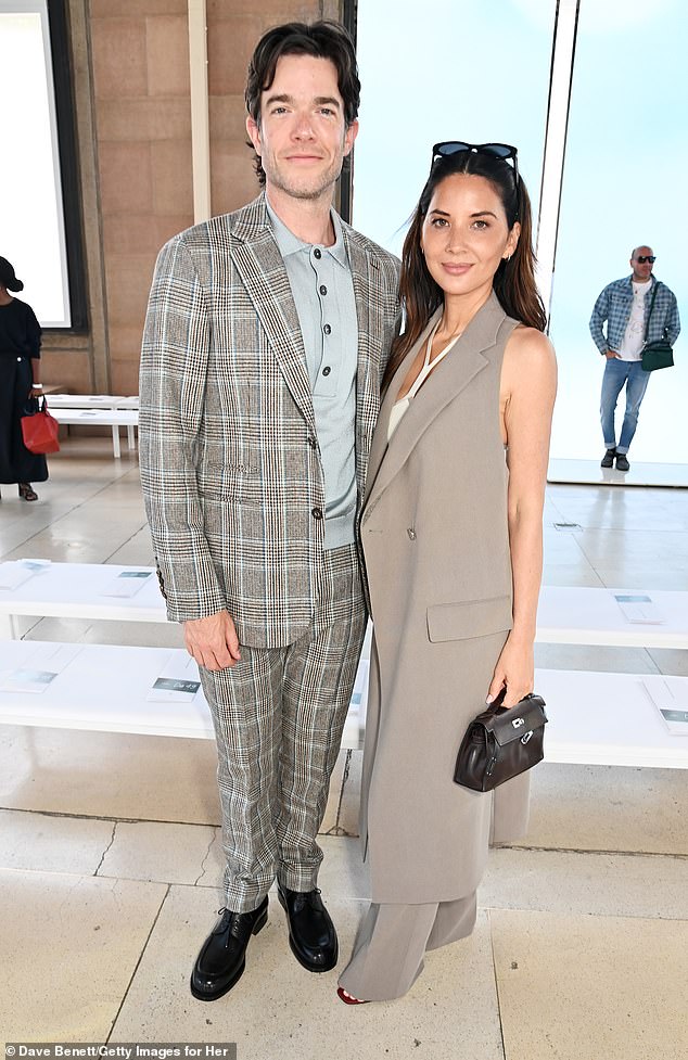 Meanwhile, her partner John, 41, who has been with Olivia since 2021, looks dapper in a gray checked suit.