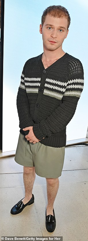 Actor Fred Hechinger opted for shorts and a crocheted black and white cardigan.