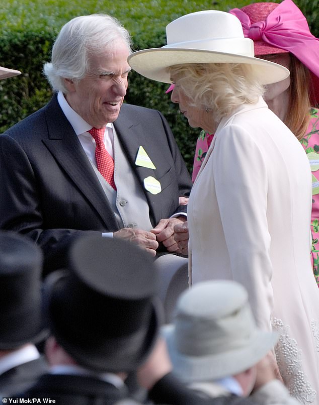 The American actor and director (pictured, left) seemed delighted to meet Queen Camilla (pictured, right) today.