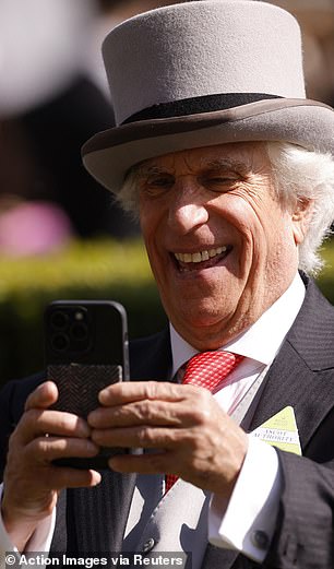 Henry Winkler takes a photograph during Royal Ascot on Saturday