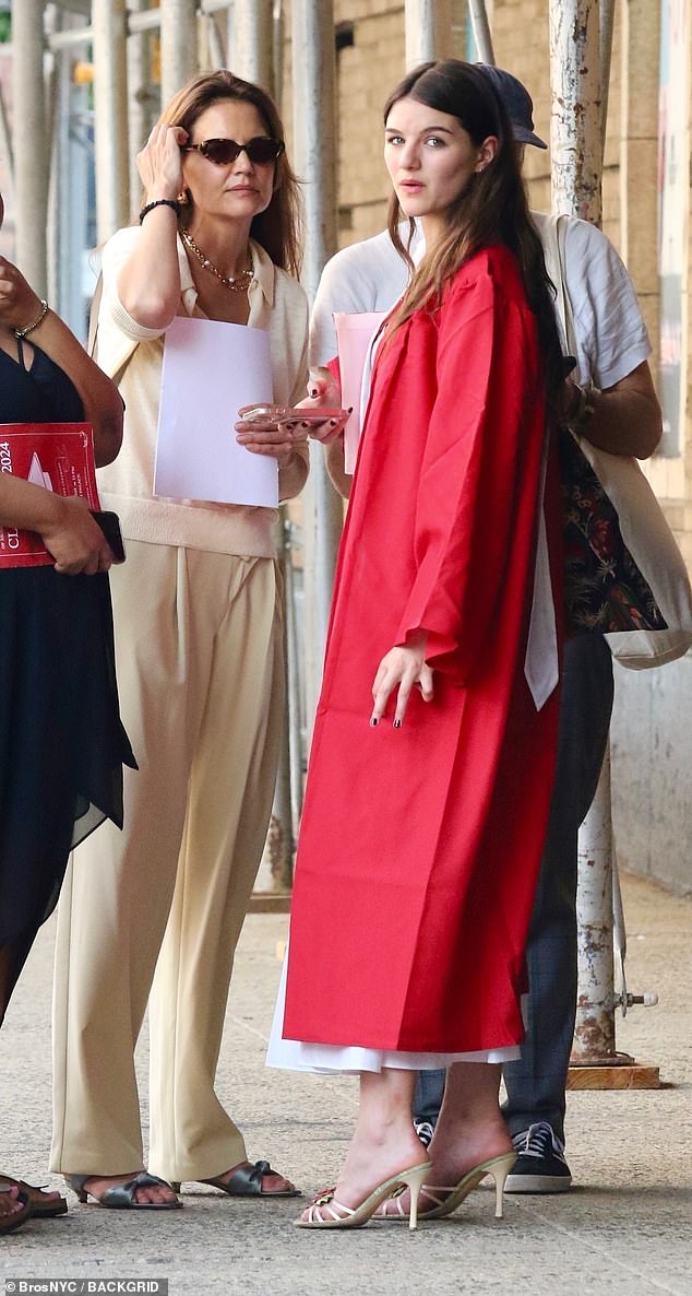 For the ceremony, which took place at the United Palace Theater in Washington Heights, the teen wore a long white dress under a bright red graduation gown, open-toed sandals, and her long hair down.