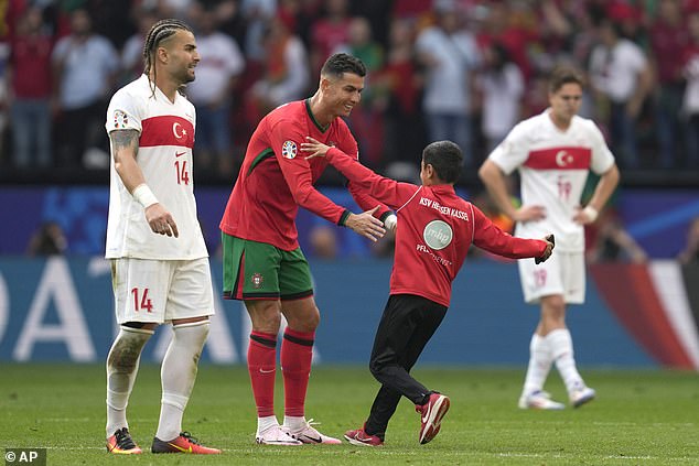 At Euro 2024, a young fan managed to evade security and ran towards Ronaldo, who stopped to hug the boy.