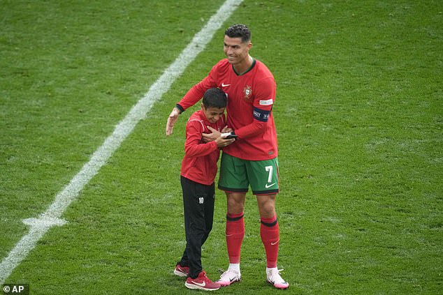 Cristiano Ronaldo made a child's dream come true after taking a photo with a fan during Portugal's clash with Turkey.