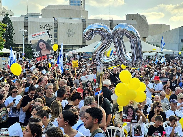 On Saturday night, Dr. Levy Shachar led thousands of people through the streets of Tel Aviv holding giant posters of his daughter and balloons to mark her birthday.