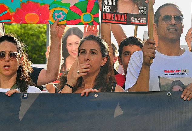 The procession marched to Hostage Square, where Naama's classmates gave speeches and performed her favorite song, Cover Me In Sunshine by P!nk.