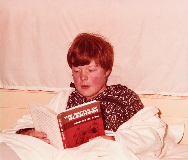 Charles Spencer, 12, reading about the Battle of Blenheim in the War of the Spanish Succession