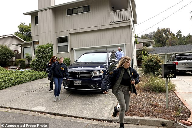 FBI agents leave a home associated with Oakland Mayor Sheng Thao