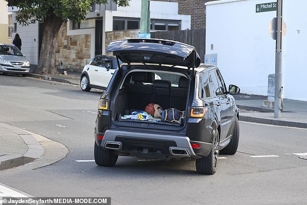 But with her mind elsewhere, the fitness guru completely forgot to close her boot as she sped down the road with all her personal items on display.