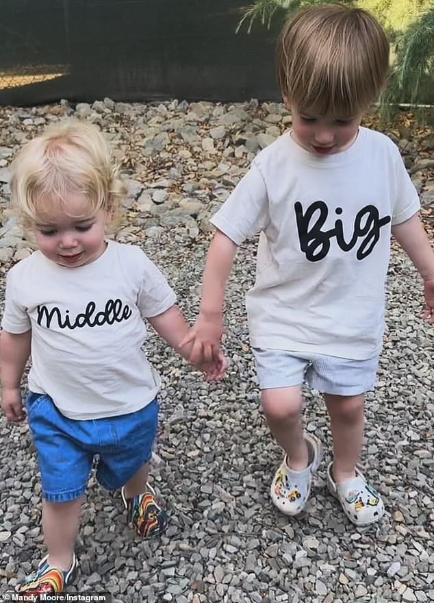 She broke the news on Friday by posting a touching photo of her sons Gus, 2, and Ozzie, 1, wearing T-shirts that read 