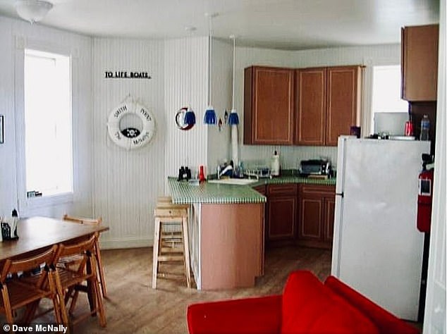 Finally, he was able to install cherry cabinets, standard appliances, and a breakfast bar in the kitchen, as well as a full bathroom and shower.