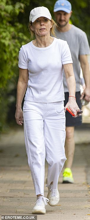 The singer turned heads in a plain casual t-shirt and matching jeans, opting for her tried-and-true all-white look.