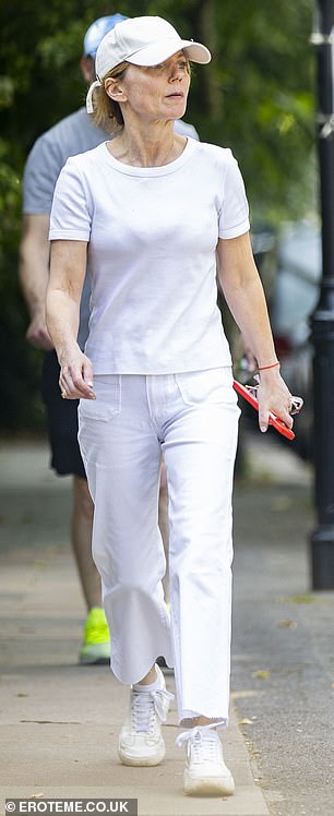 Geri completed the look with white sneakers and looked lost in thought as she walked down a London street.