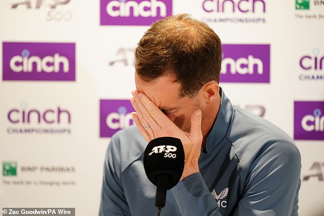 Andy Murray holds his head in his hands during a press conference after an injury forced him to withdraw from his maths match against Jordan Thompson at Queen's Club on June 19.