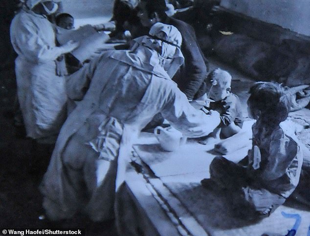 Personnel from the puppet state of Manchukuo conducting bacteriological tests on infants and young children, led by Japanese Army Unit 73, in November 1940.