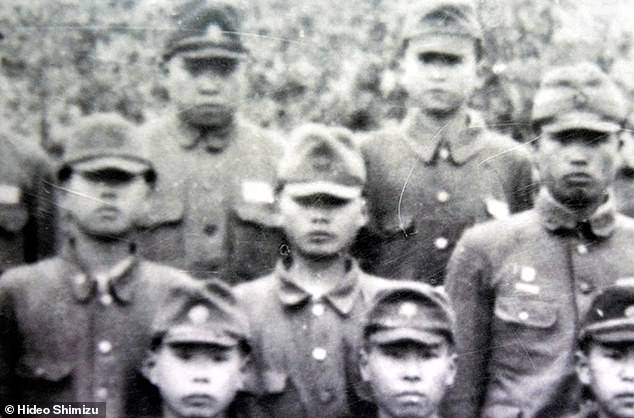 Hideo Shimizu, center, in 1945 when he was a teenage cadet who had just been recruited into Unit 731.