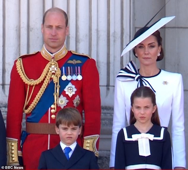 Prince Louis scrunched up his face after his older sister Charlotte told him to put his hands down.