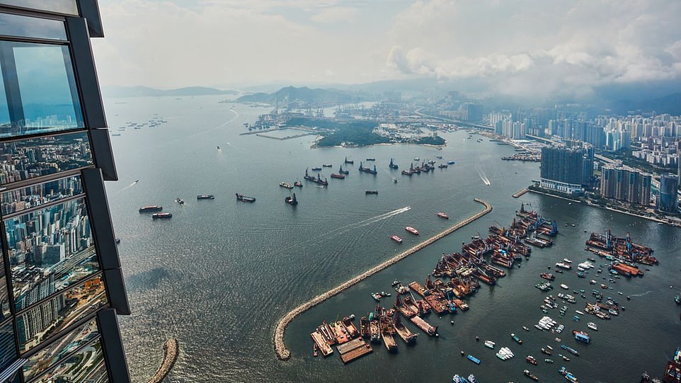 The hotel's floor-to-ceiling windows have views of the South China Sea and Hong Kong Island.