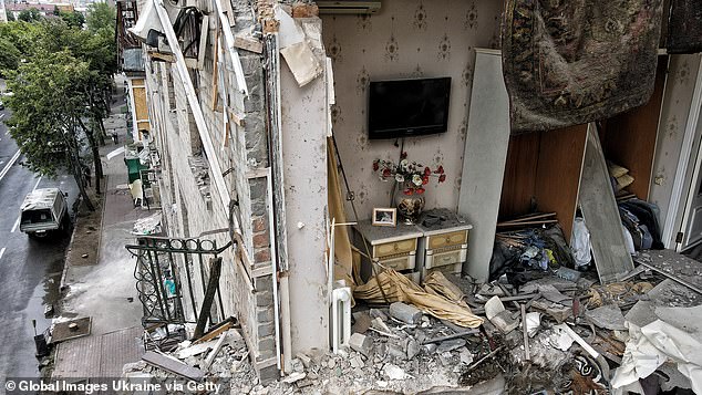 The ruined remains of an apartment are left exposed to the air after Russian missiles damaged a block of flats in Kharkiv, Ukraine, on Sunday.