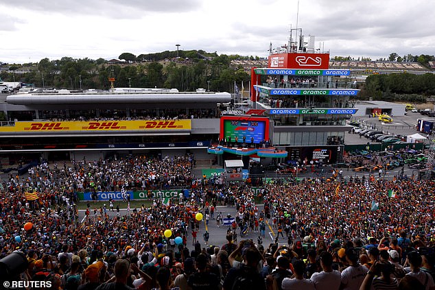 Fans gathered on the track to witness the podium ceremony following Verstappen's brilliant victory.