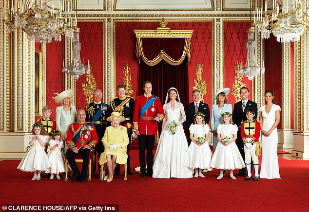 Carole and Michael with their other children, Pippa and James, and the Royal Family on Kate and William's wedding day in 2011.