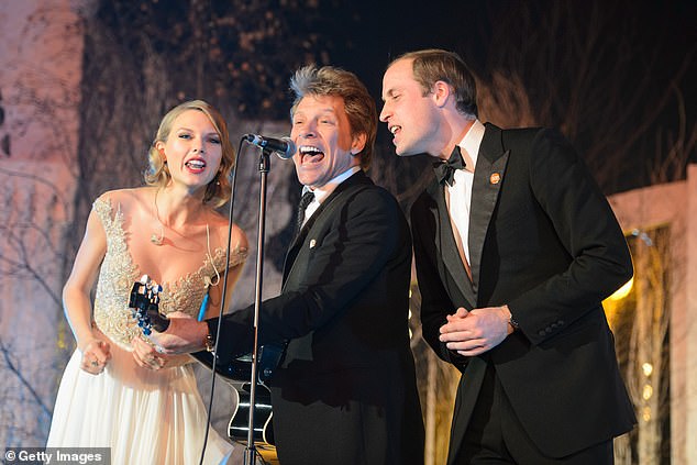 Taylor Swift, Jon Bon Jovi and Prince William are pictured singing Livin' On A Prayer on stage at the Centrepoint Gala Dinner at Kensington Palace in London on November 26, 2013, after the royals obeyed 