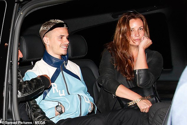 The footballer, also 21, was seen partying in the French capital with a friend on Friday night.